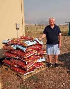 Local resident bring 21 bags of dog food to Rescue Ranch for McKInney Fire Dogs