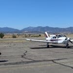 Rescue Puppy Iris adopters arrive in their plane