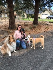 Alicarmen with Zoie, now Rosie, and family dogs posing