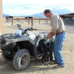 Pocket pittie, John getting Ramona to climb on ATV