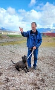 Rescue Ranch Pit Bulls, Rick holding a treat for Onyx