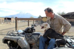 Pocket pittie, Ramona on John's lap on ATV