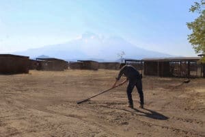 Giving Tuesday 2022, Rescue Ranch Sanctuary_John preparing ground surface for whelping sheds