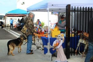 D & S Harley Davidson Pet Day, Red Dog Pet Supply Table with customer and GSD