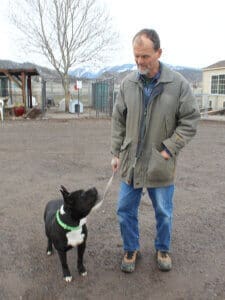 Amazing dog, Benny post op outside with Rescue RAnch Manager Rick Formanek