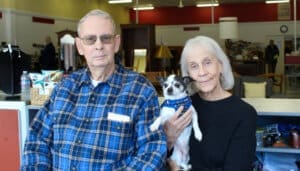 Foster a Dog, Foster to aopdt, volunteers Sue and Bill Doron with their foster to adopt dog, Maverick.