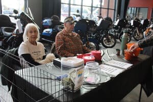 Rescue Ranch volunteers, ue and Bill Doron at Harley adoptiong event