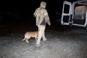 Team member, Ari loading a RRAAP dog