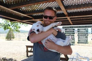 Team member, Ari with Ash during foster visit at adoption center