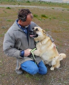 Heartworm treatment, Happy fully recovered Robbie cuddling with Rick Formanek