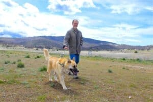 Adoption Center Manager Rick Formanek out on walk with Robbie