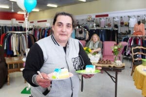 Thrift Store Anniversary visitor with cake