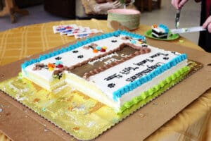 Thrift Store Anniversary, cut cake