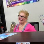 Patricia Red Dog Pet Supply store manager behind counter