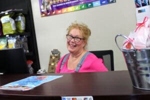 Patricia Red Dog Pet Supply store manager behind counter