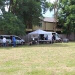 Dog adoptions, Rescue Ranch Team setting up on lawn, wide shot