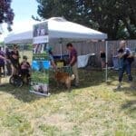 Dog adoptions, Sanctuary one tent and teble with visitors