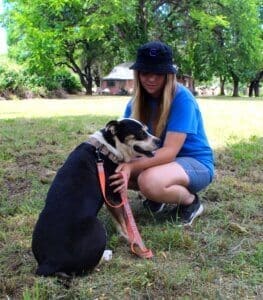 Dog adoptions, Snuggles getting chest rub from Thea