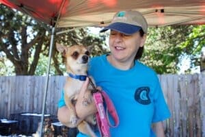 Oldies volunteer Julie with Mazi at Red Dog Pet Supply Puppy Pool and Adoption Event