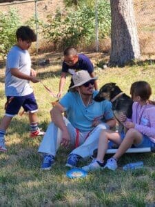 Dog socialization training camp_ Analyn and Dad working with Mira