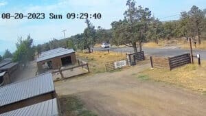 Sequence of John Golay's white truck going through the gate and leaving Sanctuary in the morning