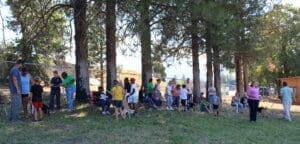 Dog socialization training camp_dogs and kids mingling with audience