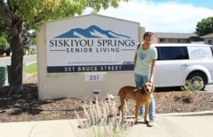 Fun Day, Tucker posing in front of sign