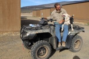 Pit Bull Awareness Month, Ramona riding ATV with John Golay