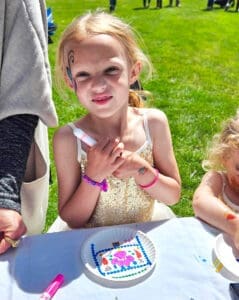 Dog Paw Prints_Kid posing with decorated paper plate