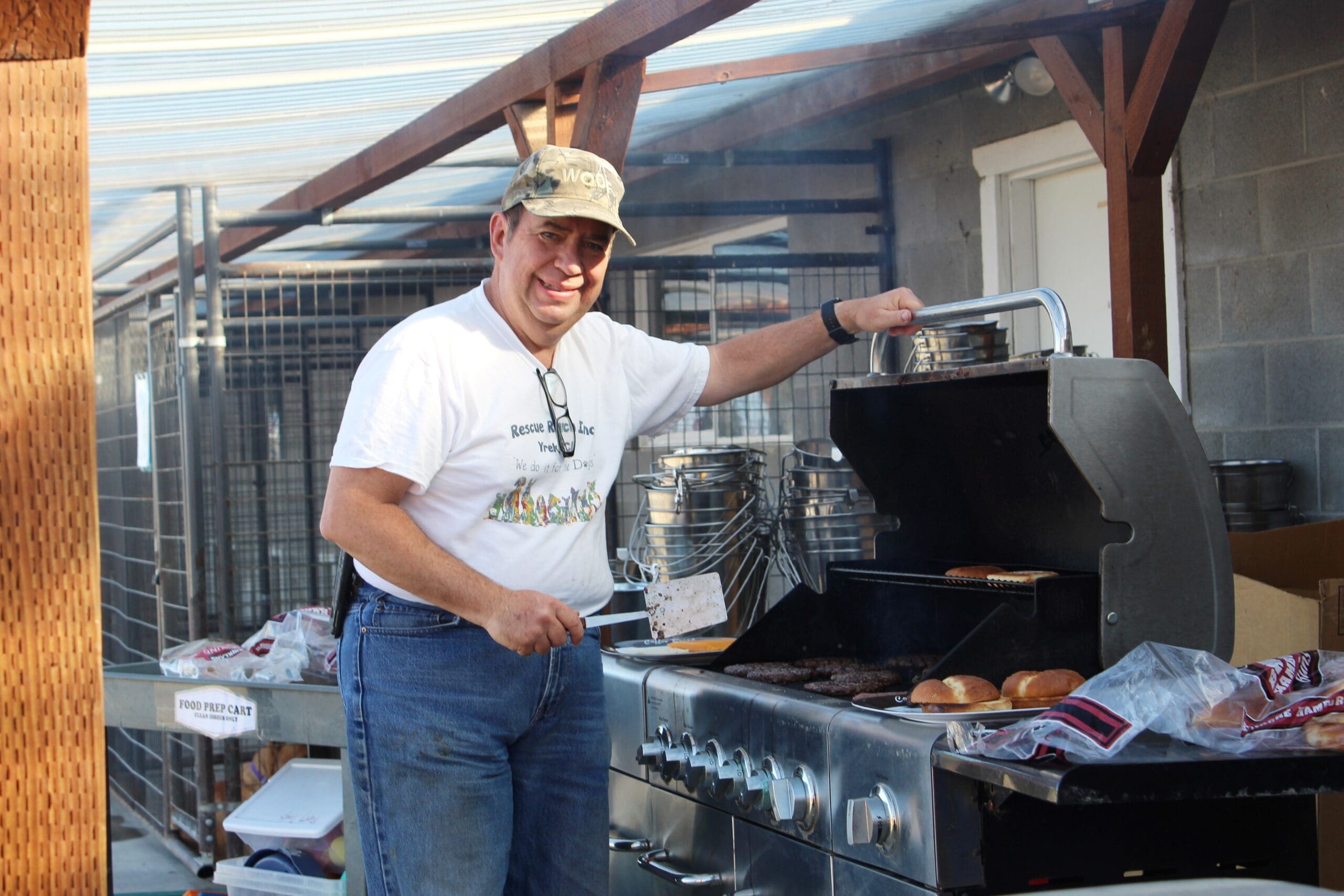 Volunteer grillling up burgers