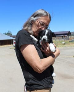 injured puppies_Laura holding Duncan when he returns from the vet