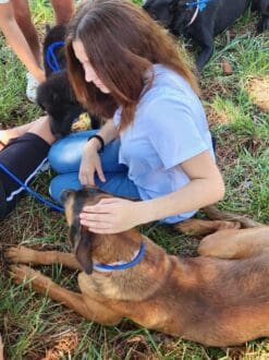 Weed_Training_Camp_Girl_Petting_Adolescent_Pup